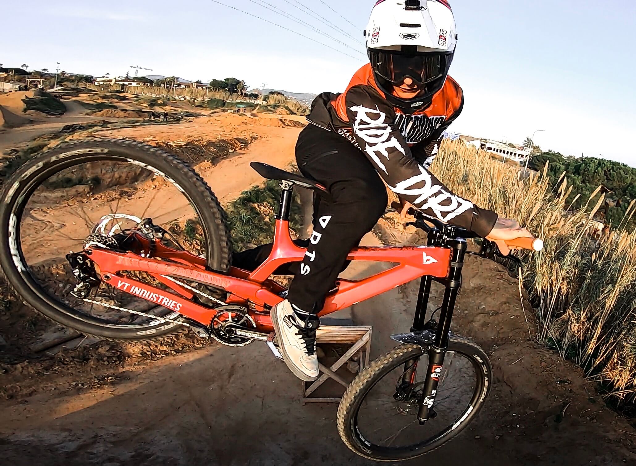 MTB rider jumping on red bike