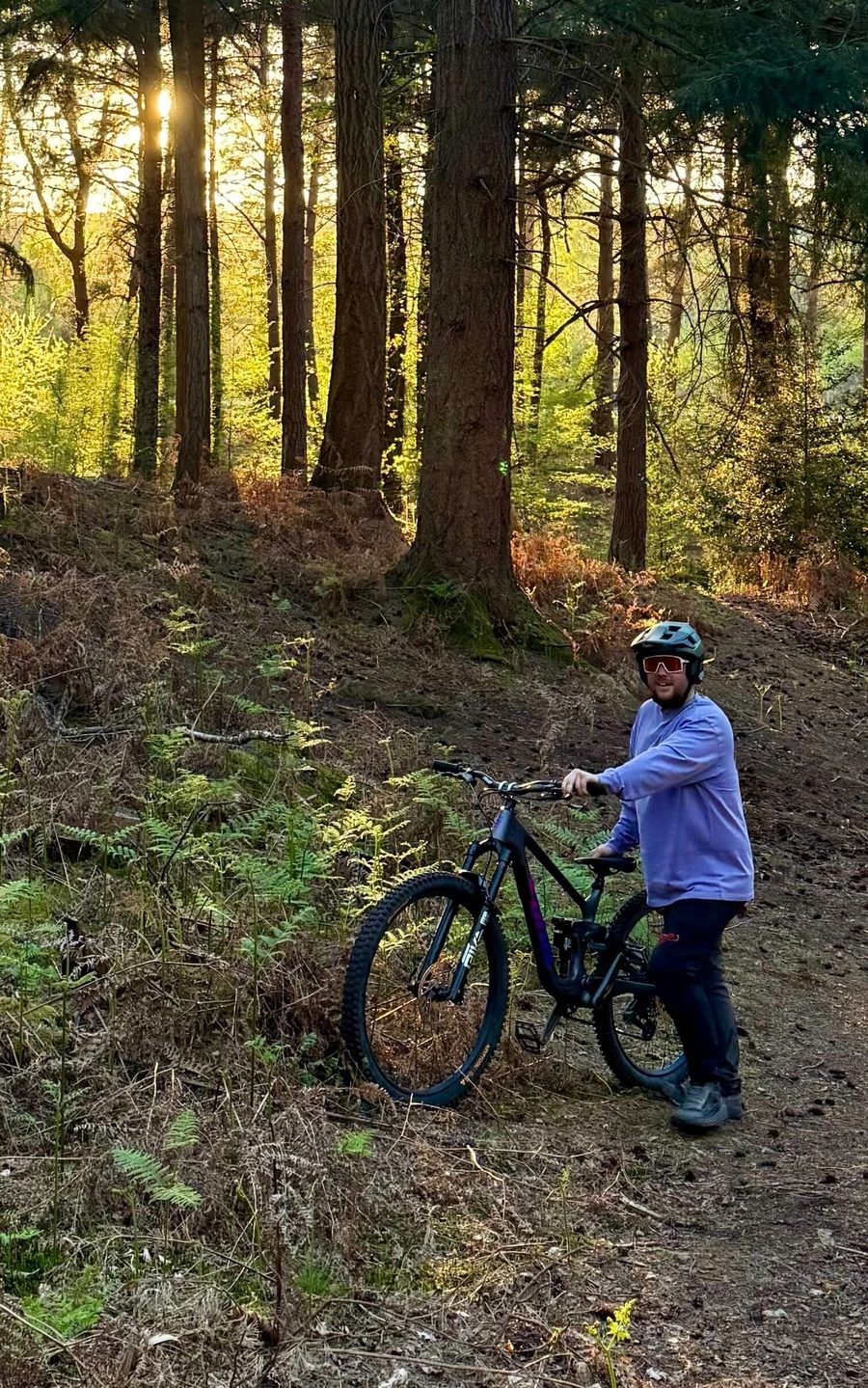 Rider on mixed-light trail wearing Melon photochromic