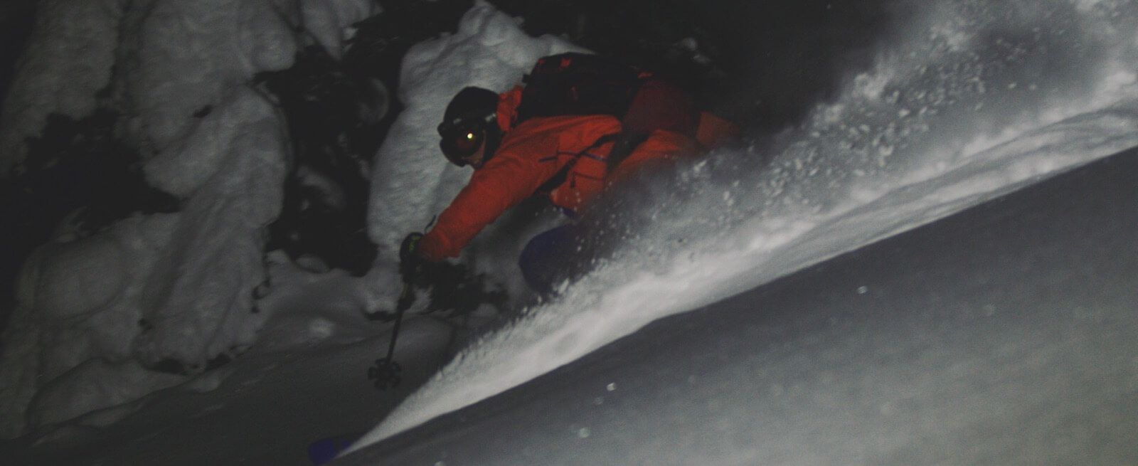 Kieran Nikula laying some night time powder turns