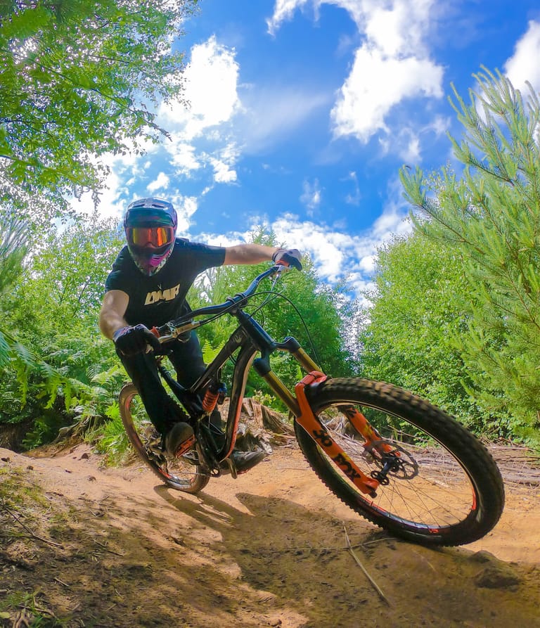 Ben Deakin riding dusty trail